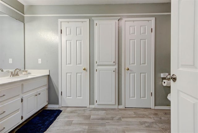 8517 SW 36th Ter, Oklahoma City, OK 73179 - bathroom with vanity and wood finished floors
