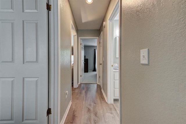 8517 SW 36th Ter, Oklahoma City, OK 73179 - hall featuring light wood-type flooring and a textured wall