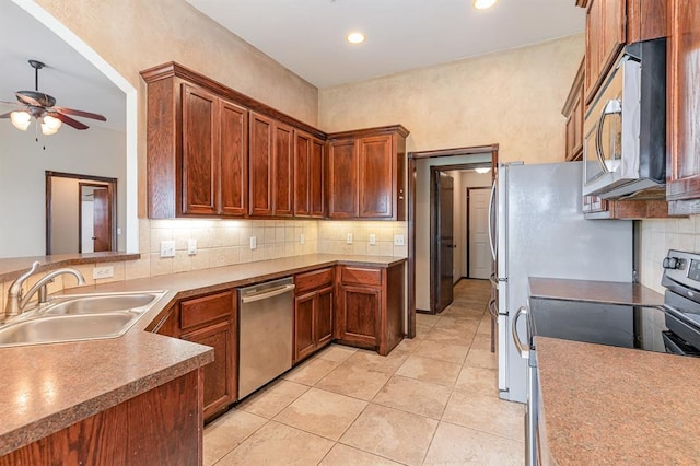 2524 Faint Ridge Way, Piedmont, OK 73078 - kitchen featuring stainless steel appliances, a ceiling fan, tasteful backsplash, light tile patterned floors, and recessed lighting