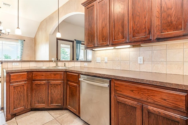 2524 Faint Ridge Way, Piedmont, OK 73078 - kitchen featuring stainless steel dishwasher, healthy amount of natural light, light tile patterned flooring, tasteful backsplash, and vaulted ceiling