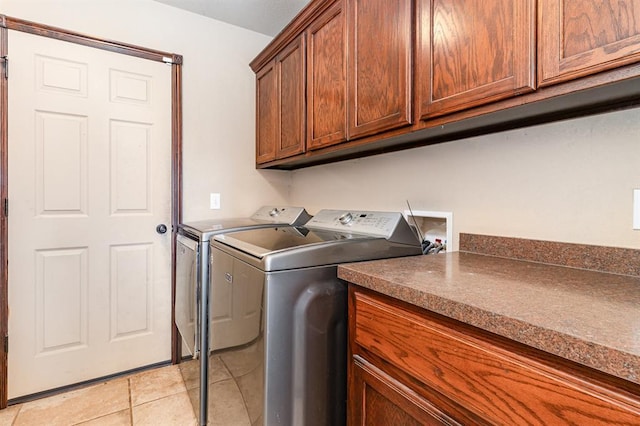 2524 Faint Ridge Way, Piedmont, OK 73078 - laundry area featuring washer and clothes dryer, light tile patterned flooring, and cabinet space