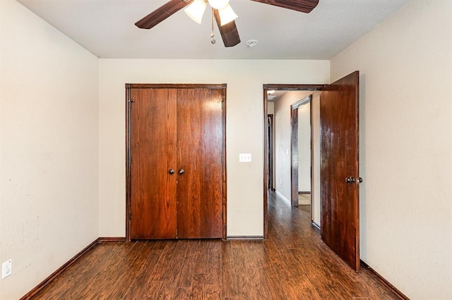 2524 Faint Ridge Way, Piedmont, OK 73078 - unfurnished bedroom with dark wood-type flooring, a ceiling fan, and a closet