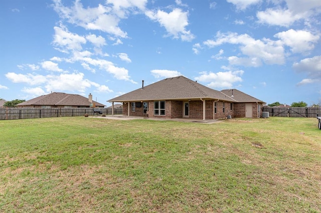 2524 Faint Ridge Way, Piedmont, OK 73078 - rear view of property featuring a patio area, brick siding, and a fenced backyard