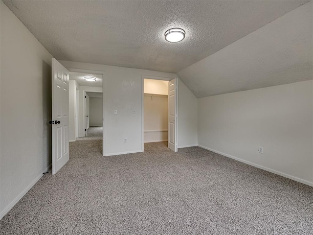 4821 Cinderella Dr, Oklahoma City, OK 73129 - bonus room with a textured ceiling, carpet, and vaulted ceiling