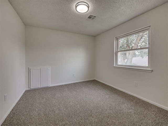 4821 Cinderella Dr, Oklahoma City, OK 73129 - carpeted empty room featuring a textured ceiling and baseboards