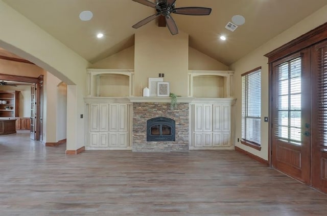 30202 Sleepy Hollow Dr, Mcloud, OK 74851 - unfurnished living room with ceiling fan, arched walkways, wood finished floors, high vaulted ceiling, and recessed lighting