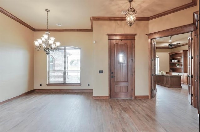30202 Sleepy Hollow Dr, Mcloud, OK 74851 - foyer entrance with a chandelier, light wood finished floors, and crown molding