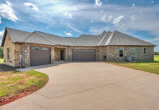 30202 Sleepy Hollow Dr, Mcloud, OK 74851 - french country home featuring an attached garage, a front lawn, roof with shingles, and driveway