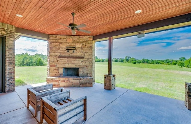 30202 Sleepy Hollow Dr, Mcloud, OK 74851 - view of patio / terrace featuring an outdoor stone fireplace and ceiling fan