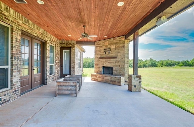 30202 Sleepy Hollow Dr, Mcloud, OK 74851 - view of patio / terrace with an outdoor stone fireplace and ceiling fan