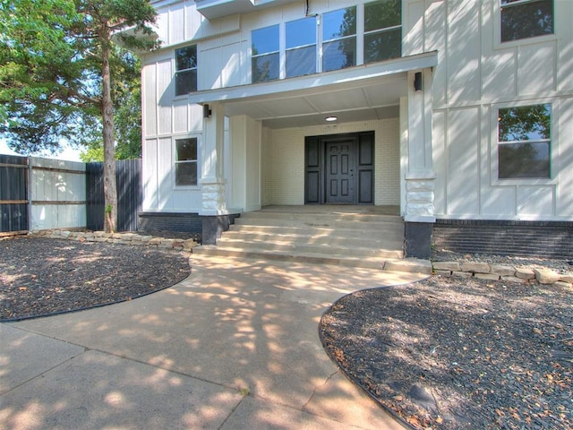 1231 NW 33rd St, Oklahoma City, OK 73118 - view of exterior entry featuring a porch and brick siding