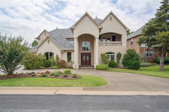 13209 Blue Canyon Cir, Oklahoma City, OK 73142 - french country style house with a front lawn, stucco siding, and curved driveway