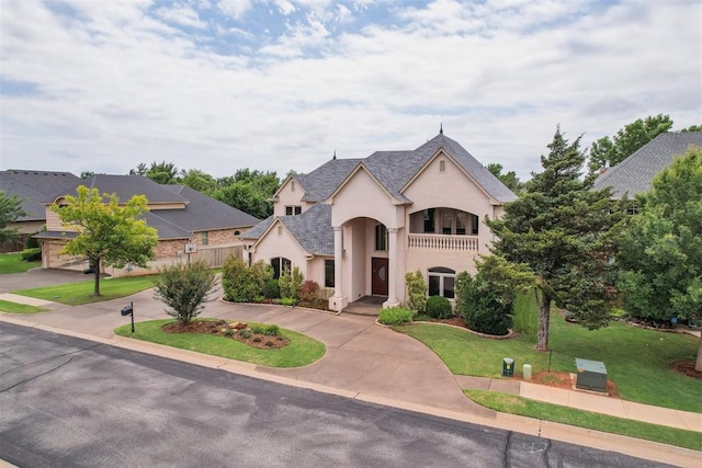 13209 Blue Canyon Cir, Oklahoma City, OK 73142 - french country style house with stucco siding, a front yard, and curved driveway
