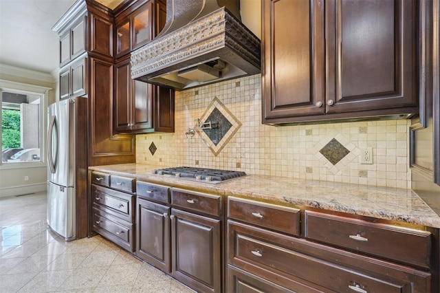13209 Blue Canyon Cir, Oklahoma City, OK 73142 - kitchen featuring custom exhaust hood, appliances with stainless steel finishes, granite floors, light stone counters, and tasteful backsplash