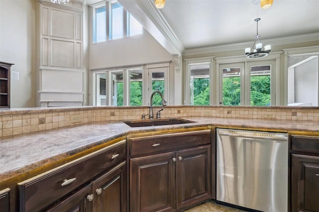 13209 Blue Canyon Cir, Oklahoma City, OK 73142 - kitchen with dishwasher, dark brown cabinetry, a chandelier, tasteful backsplash, and ornamental molding