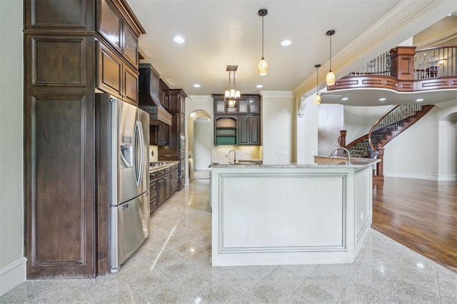 13209 Blue Canyon Cir, Oklahoma City, OK 73142 - kitchen featuring stainless steel appliances, custom range hood, crown molding, granite tiled floors, and dark brown cabinets