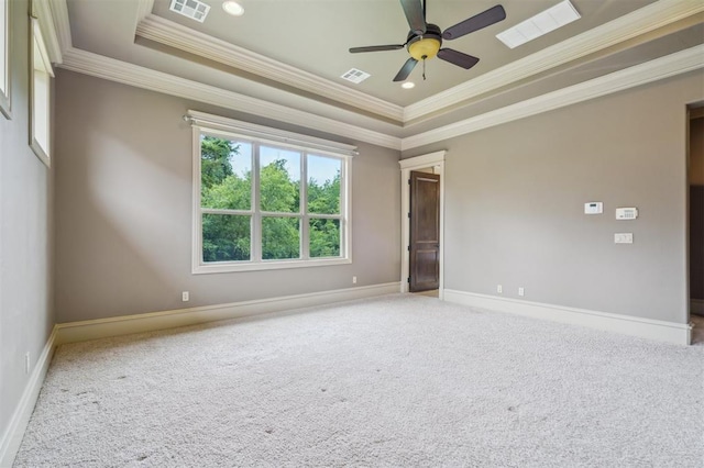13209 Blue Canyon Cir, Oklahoma City, OK 73142 - carpeted spare room featuring crown molding, a tray ceiling, and ceiling fan