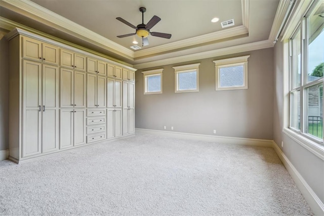 13209 Blue Canyon Cir, Oklahoma City, OK 73142 - unfurnished bedroom with light colored carpet, crown molding, a tray ceiling, and a ceiling fan