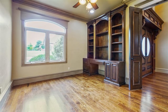 13209 Blue Canyon Cir, Oklahoma City, OK 73142 - unfurnished office featuring wood finished floors, ceiling fan, crown molding, and built in study area