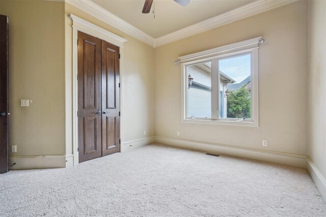 13209 Blue Canyon Cir, Oklahoma City, OK 73142 - spare room featuring carpet flooring, ornamental molding, and a ceiling fan
