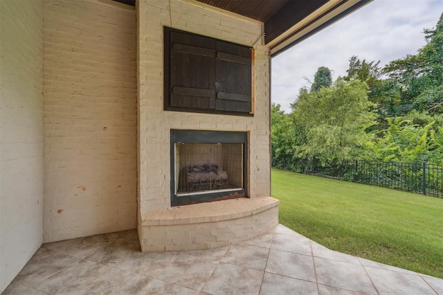 13209 Blue Canyon Cir, Oklahoma City, OK 73142 - view of patio / terrace with an outdoor brick fireplace