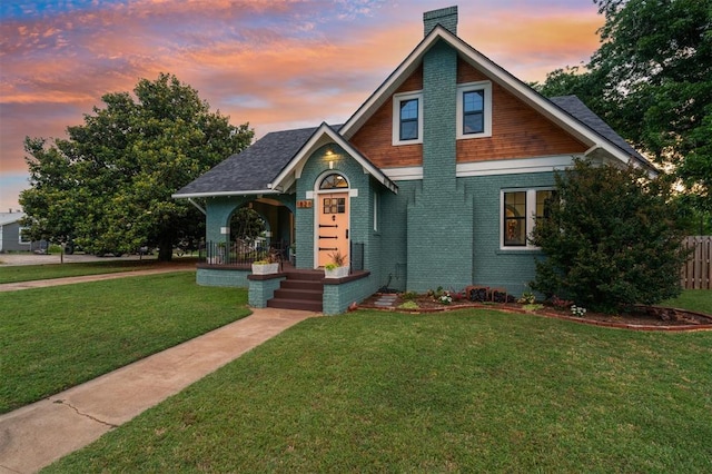 1828 S 7th St, Chickasha, OK 73018 - craftsman house featuring a chimney, brick siding, and a shingled roof