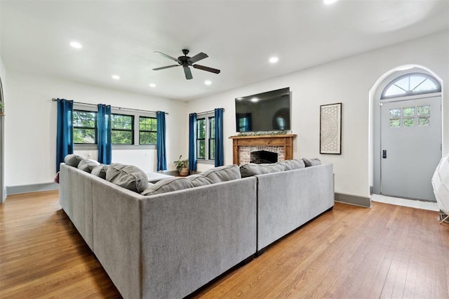 1828 S 7th St, Chickasha, OK 73018 - living room with ceiling fan, recessed lighting, a brick fireplace, and wood finished floors