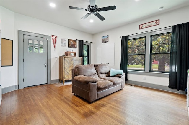 1828 S 7th St, Chickasha, OK 73018 - living room with light wood finished floors, healthy amount of natural light, ceiling fan, and recessed lighting