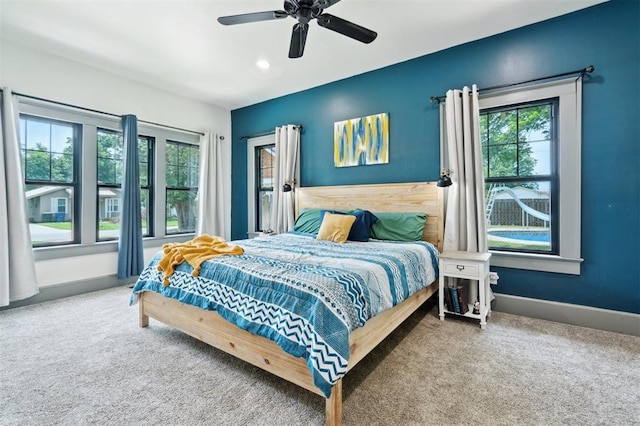 1828 S 7th St, Chickasha, OK 73018 - carpeted bedroom featuring multiple windows and a ceiling fan