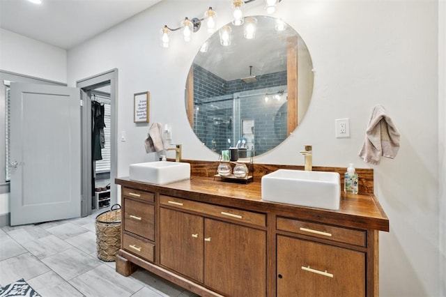 1828 S 7th St, Chickasha, OK 73018 - full bath with double vanity, a stall shower, and a spacious closet