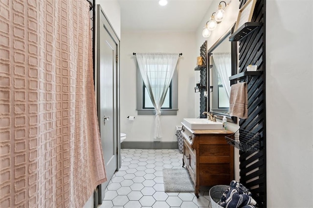 1828 S 7th St, Chickasha, OK 73018 - bathroom featuring vanity, tile patterned floors, and recessed lighting