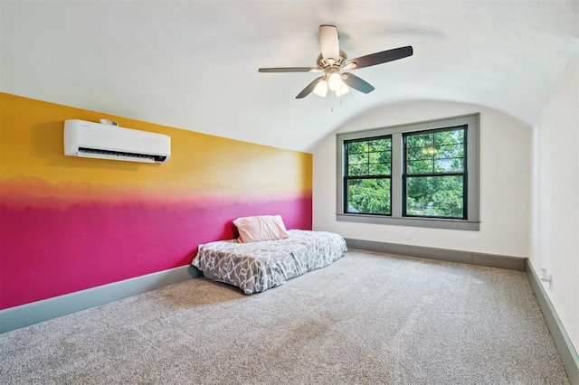 1828 S 7th St, Chickasha, OK 73018 - bedroom featuring a wall mounted AC, vaulted ceiling, carpet flooring, and a ceiling fan