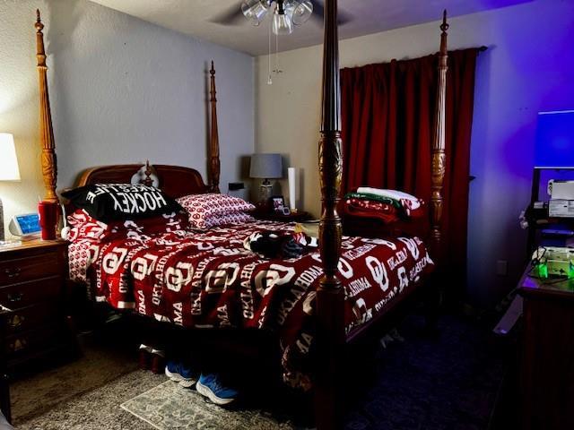 13501 E Memorial Rd, Jones, OK 73049 - bedroom featuring a ceiling fan and carpet floors