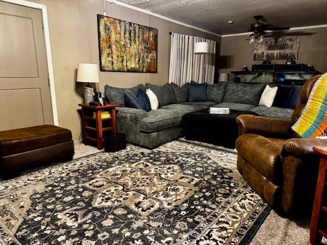 13501 E Memorial Rd, Jones, OK 73049 - living room with ceiling fan, crown molding, and carpet flooring