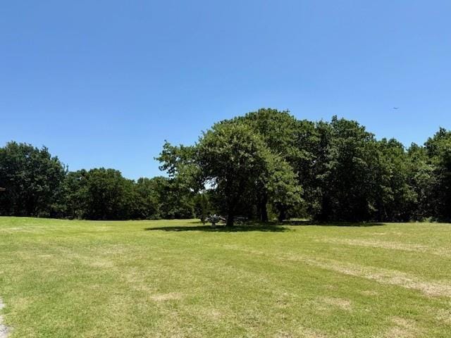 13501 E Memorial Rd, Jones, OK 73049 - view of grassy yard with a forest view