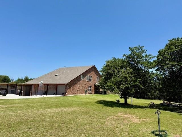 13501 E Memorial Rd, Jones, OK 73049 - view of property exterior with a lawn and an attached garage