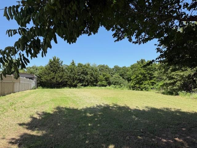 13501 E Memorial Rd, Jones, OK 73049 - view of yard with a wooded view
