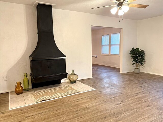 1402 S 14th St, Chickasha, OK 73018 - unfurnished living room with wood finished floors and ceiling fan