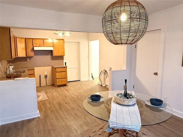 1402 S 14th St, Chickasha, OK 73018 - dining room with light wood finished floors and baseboards