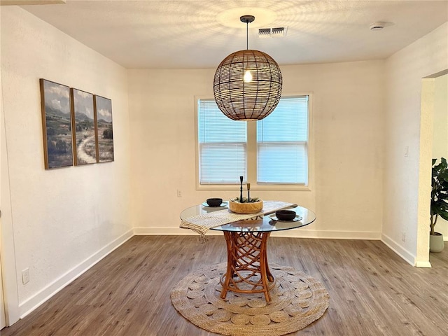 1402 S 14th St, Chickasha, OK 73018 - dining area featuring wood finished floors and baseboards