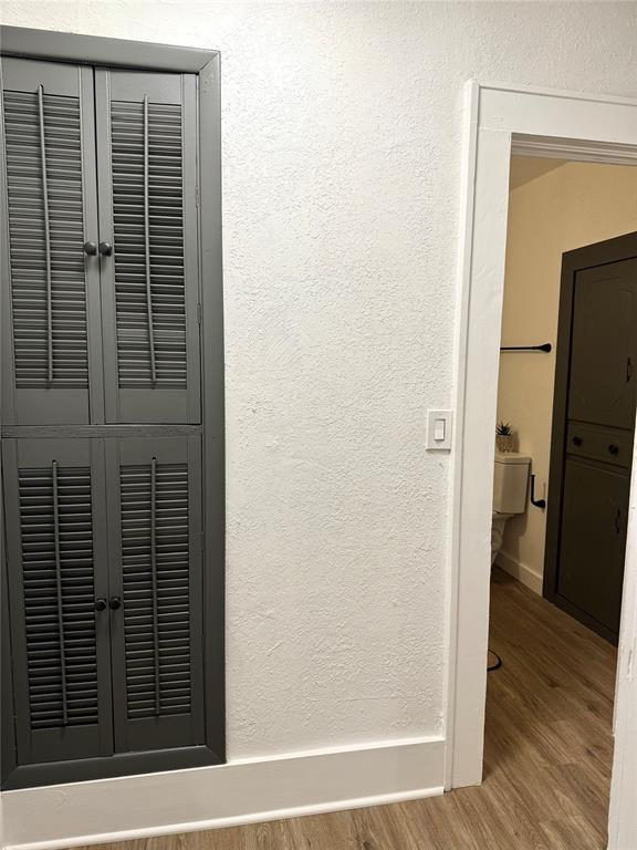 1402 S 14th St, Chickasha, OK 73018 - detailed view of wood finished floors and baseboards