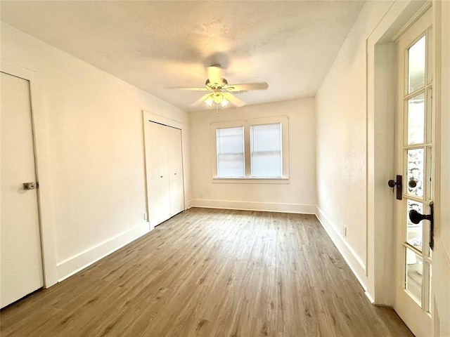 1402 S 14th St, Chickasha, OK 73018 - unfurnished room with wood finished floors and a ceiling fan