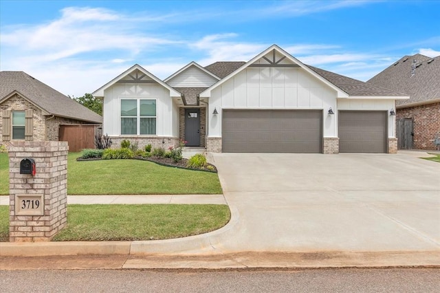 3719 Timberbrook Dr, Norman, OK 73069 - view of front of house with a garage, brick siding, board and batten siding, concrete driveway, and a front yard