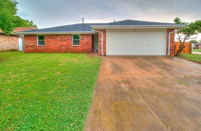 648 NW 18th St, Moore, OK 73160 - ranch-style home with brick siding, driveway, and a garage