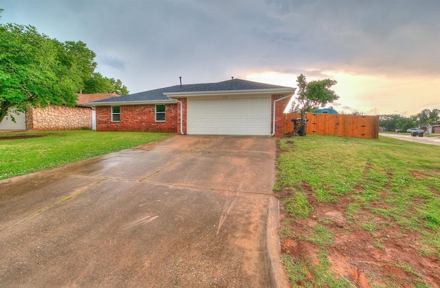 648 NW 18th St, Moore, OK 73160 - ranch-style house featuring a garage, concrete driveway, and brick siding