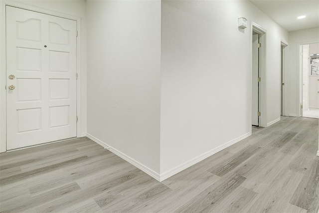 648 NW 18th St, Moore, OK 73160 - hall with light wood-style flooring and recessed lighting