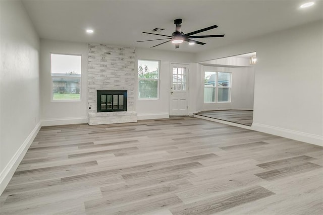 648 NW 18th St, Moore, OK 73160 - unfurnished living room featuring a ceiling fan, a large fireplace, wood finished floors, and recessed lighting