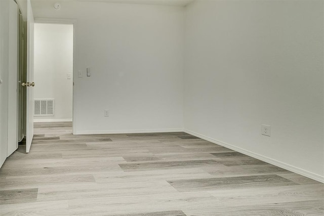 648 NW 18th St, Moore, OK 73160 - empty room with light wood finished floors and a smoke detector