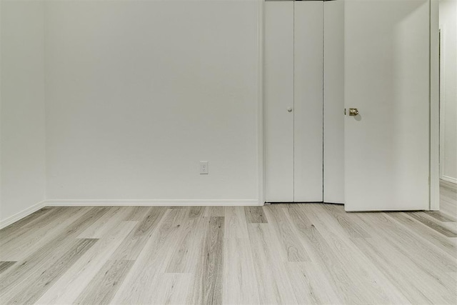 648 NW 18th St, Moore, OK 73160 - unfurnished bedroom with light wood-type flooring and a closet