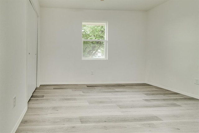 648 NW 18th St, Moore, OK 73160 - empty room featuring light wood-type flooring and baseboards